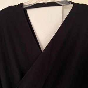 V-neck backless sweater dress with batwing sleeves.